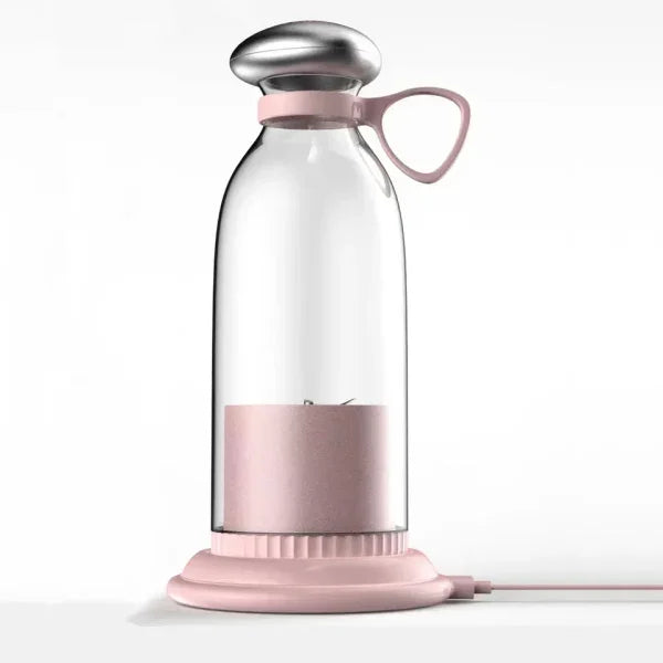Pink portable electric milk frother with glass bottle and USB base for home kitchen use